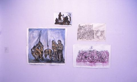 Installation. Four sketches in various mediums are assembled on a white surface. Each of the sketches depicts multiple  piled, heaped and writhing bodies.