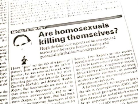Video still. Blurry image of a newspaper article headline reading \"Are Homosexuals Killing Themselves?\".